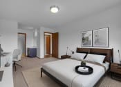 Thumbnail 5 of 56 - a bedroom with a bed and a desk in a room