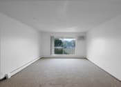 Thumbnail 24 of 56 - a bedroom with a large window and white walls