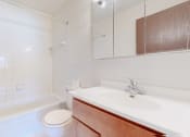 Thumbnail 13 of 56 - a bathroom with a sink toilet and bathtub