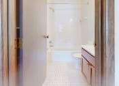 Thumbnail 12 of 56 - a bathroom with a toilet sink and bathtub