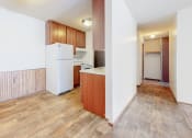 Thumbnail 16 of 56 - a kitchen with a white refrigerator freezer next to a white stove top oven
