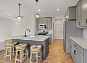 Thumbnail 22 of 48 - Island Kitchen at Foxtail Hollow Townhomes, Blaine