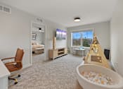 Thumbnail 24 of 48 - Living Room With TV at Foxtail Hollow Townhomes, Blaine, MN