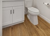 Thumbnail 30 of 48 - a bathroom with a toilet sink and mirror at Foxtail Hollow Townhomes, Blaine, MN