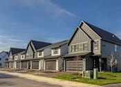Thumbnail 37 of 48 - a house with a street in front of it at Foxtail Hollow Townhomes, Blaine, MN
