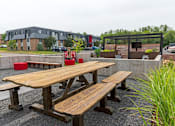 Thumbnail 9 of 40 - a picnic table in front of a building