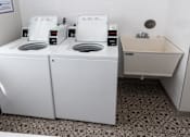 Thumbnail 39 of 40 - a washer and dryer in a laundry room