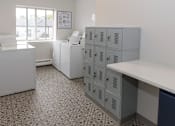 Thumbnail 40 of 40 - a room with white cabinets and a window