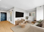Thumbnail 104 of 110 - A modern living room with a grey sofa and a wooden coffee table.