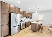 Thumbnail 101 of 110 - A modern kitchen with wooden cabinets and stainless steel appliances.