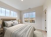 Thumbnail 30 of 52 - A bedroom with a large bed and a view of the beach.