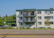 Thumbnail 2 of 38 - an image of an apartment building on the side of the street