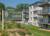 Thumbnail 1 of 38 - an image of an apartment building with a sign for joplin lane