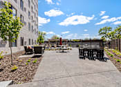 Thumbnail 14 of 37 - Concrete patio at Lux Apartments, Brooklyn Center, Minnesota