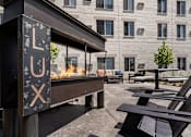 Thumbnail 9 of 37 - Outdoor courtyard area at Lux Apartments, Brooklyn Center, MN, 55430