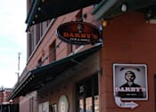 Thumbnail 54 of 55 - A red brick building with a sign that says Darby's.