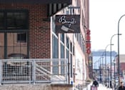 Thumbnail 48 of 55 - A street view with a building that has a sign that says "Bonzo".