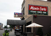 Thumbnail 50 of 55 - A restaurant named Monte Carlo serves steaks, chops, and fish.