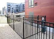 Thumbnail 59 of 73 - A black metal fence in front of a red building.at Third North Apartments, Minnesota