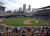 Thumbnail 70 of 73 - A baseball stadium is filled with fans watching a game.at Third North Apartments, Minneapolis