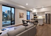 Thumbnail 64 of 77 - Living Room With Kitchen View at Viridium Apartments, Minnesota, 55401