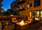 Thumbnail 70 of 77 - A patio with a fire pit and chairs.at Viridium Apartments, Minneapolis, 55401 