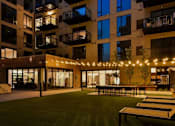 Thumbnail 72 of 77 - A building with a lawn and lights in front.at Viridium Apartments, Minneapolis 