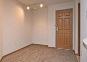 Thumbnail 13 of 30 - A Room with a Brown Door at Joseph's Pointe at Upper Landing Apartments, St. Paul, MN, 55102