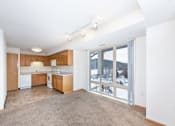 Thumbnail 15 of 30 - Kitchen with Wooden Cabinets at Joseph's Pointe at Upper Landing Apartments, St. Paul, Minnesota