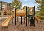 Thumbnail 23 of 30 - A Playground with a Yellow Slide at Joseph's Pointe at Upper Landing Apartments, St. Paul