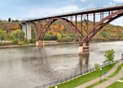 Thumbnail 24 of 30 - A Bridge Spans Over a River at Joseph's Pointe at Upper Landing Apartments, Minnesota, 55102