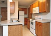 Thumbnail 3 of 30 - Kitchen with Wooden Cabinets at Joseph's Pointe at Upper Landing Apartments, St. Paul, 55102