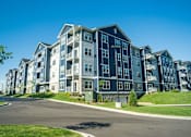 Thumbnail 2 of 80 - A large apartment complex with multiple buildings and balconies at The Barnum Apartments, White Bear Lake, Minnesota