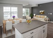 Thumbnail 69 of 80 - Living room with dinning table at The Barnum Apartments, White Bear Lake