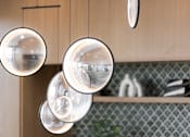 Thumbnail 8 of 92 - Four hanging lights are suspended from a wooden beam.