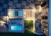 Thumbnail 66 of 92 - A modern house with a glass wall and a pool.