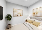 Thumbnail 79 of 92 - A bedroom with a large bed, a potted plant, and two framed artworks on the wall.