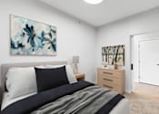 Thumbnail 109 of 110 - A bedroom with a bed, nightstand, and a painting on the wall.