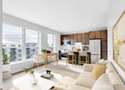 Thumbnail 71 of 92 - A modern living room with a large window overlooking a cityscape.