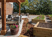 Thumbnail 10 of 31 - Patio with raised gardens