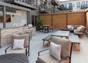Thumbnail 44 of 64 - A patio with a table and chairs.