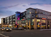 Thumbnail 1 of 64 - A large building with a sign that says