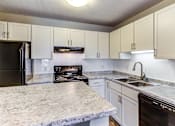 Thumbnail 26 of 83 - Granite Counter Tops In Kitchen at Audenn Apartments, Bloomington, 55438