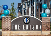 Thumbnail 2 of 81 - The Edison sign is in front of a building with balloons.