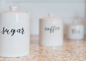 Thumbnail 23 of 81 - Three canisters, two of which are labeled sugar and coffee.
