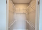 Thumbnail 36 of 81 - Empty white shelves in a pantry.