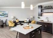 Thumbnail 46 of 81 - A modern kitchen with a dining table and chairs.