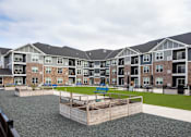 Thumbnail 68 of 81 - Apartment complex with a playground in the courtyard.