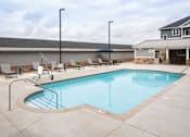 Thumbnail 73 of 81 - A small pool with a concrete floor and a metal railing.