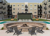 Thumbnail 2 of 32 - A fire pit surrounded by chairs in a courtyard at The Edison at Rice Creek I and II, Minnesota, 55126